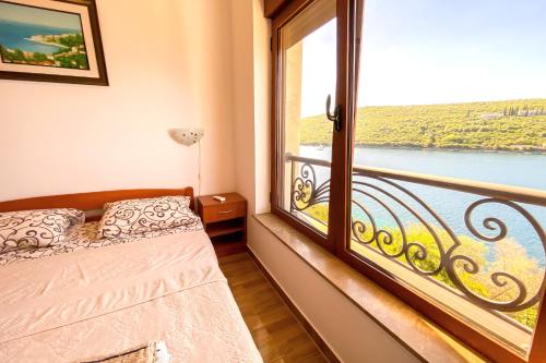 Postel nebo postele na pokoji v ubytování ViLena Apartmani