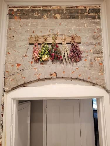a wall above a door with christmas decorations on it at High end 1B apt laundry 10ft ceilings king bed in Wilmington