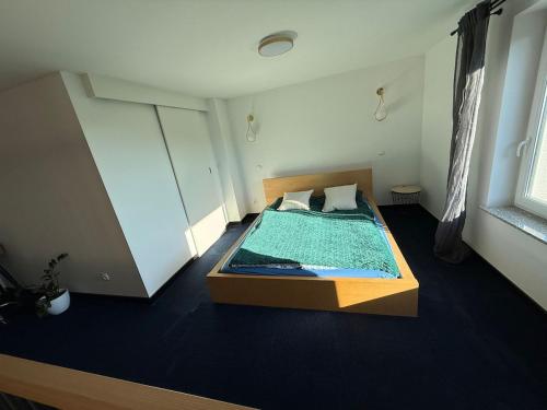 a bedroom with a large bed in a room at Sweet Home Ślęża Mountains in Sobótka