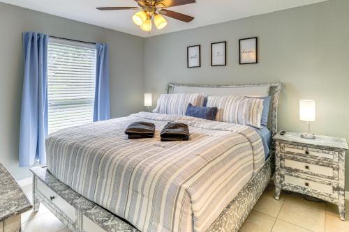 a bedroom with a bed with two bags on it at Mins to Beaches and HCA Hospital Fort Pierce Home in Fort Pierce