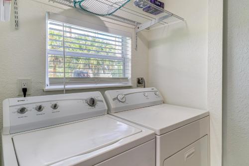a washing machine in a laundry room with a window at Mins to Beaches and HCA Hospital Fort Pierce Home in Fort Pierce
