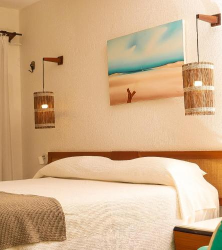 Hotel Velejar Cumbucoにあるベッド