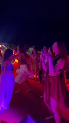 a group of people dancing at a party in the dark at Bunk Hostel Rishikesh in Rishīkesh