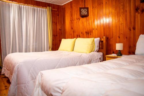 Postel nebo postele na pokoji v ubytování Cabanas Palafitos Dalmacia