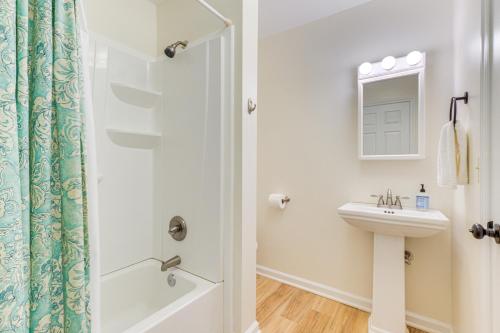 a bathroom with a sink and a shower at Cozy Cottage Just 2 Blocks From the River! in Colonial Beach