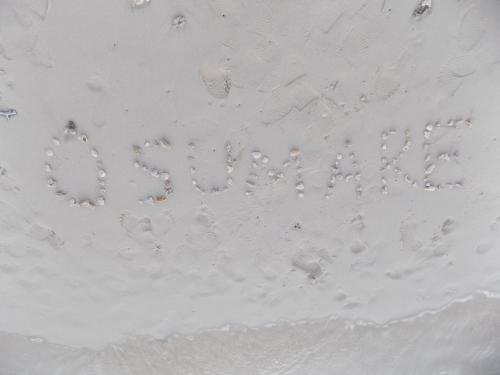 a message written in the sand on the beach at Villa Osumare Guest House in Flic-en-Flac
