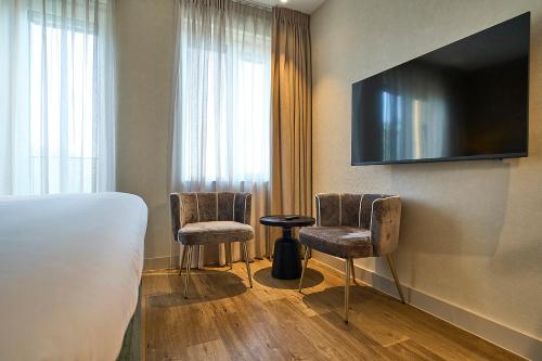 Телевизор и/или развлекательный центр в Eilandhotel Texel - Nieuw geopend hotel