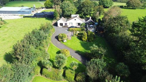 an aerial view of a house with a driveway at Apartment in the Heart of Kerry in Knockeen Cross Roads