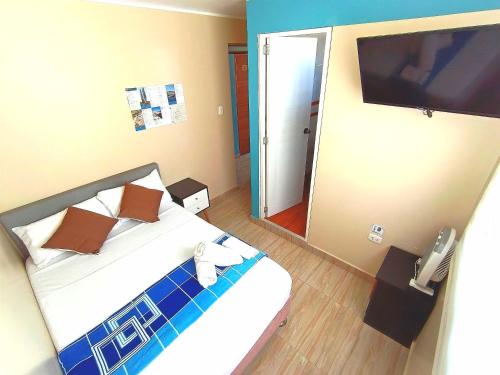 Letto o letti in una camera di HOSPEDAJE WELCOME PARACAS peru