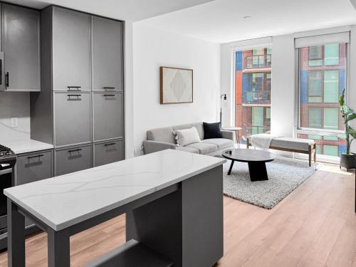 a kitchen and living room with a couch and a table at The Stay 1 - Navy Yard Washington DC in Washington