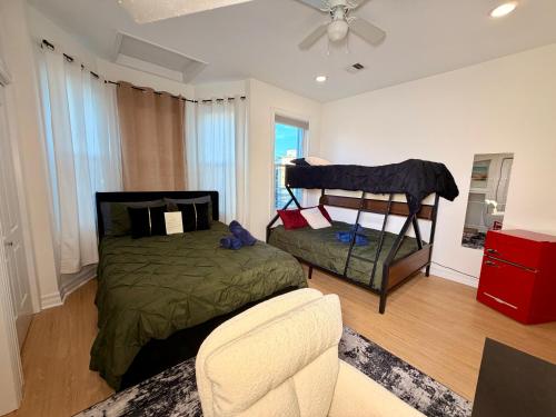 a bedroom with a bed and a chair at Hotel-Style, No Host, Professionally Managed ID247 in Jersey City