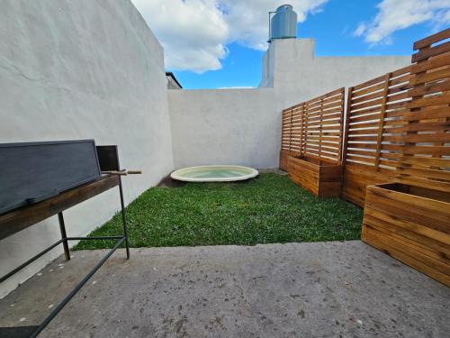 a frisbee sitting on the grass in a backyard at Loft Sp in San Pedro