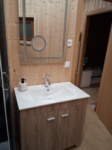 a bathroom with a sink and a mirror at Private Pool Douro River View Villa in Baião