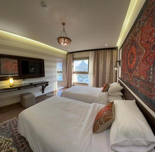 Ένα ή περισσότερα κρεβάτια σε δωμάτιο στο 7 Gates Boutique Hotel Pyramids