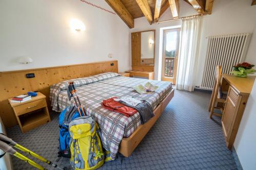 Postel nebo postele na pokoji v ubytování Hotel Melchiori