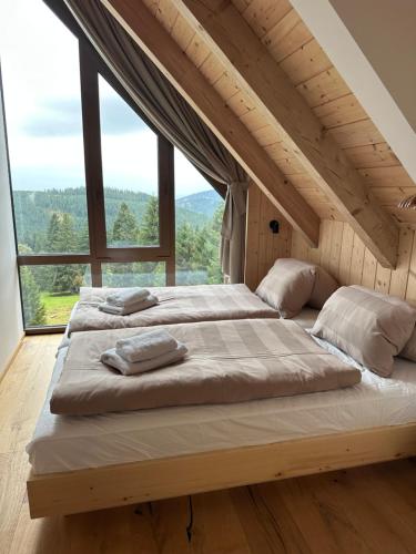 Postel nebo postele na pokoji v ubytování Chata Rebelka