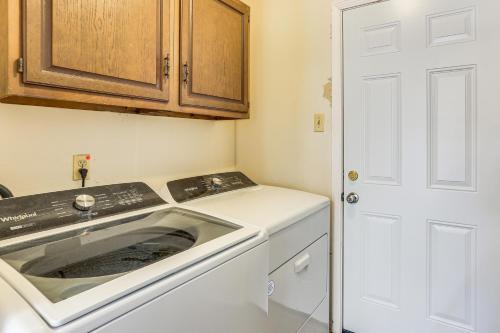 a kitchen with a stove and a white dishwasher at Fish, Golf, Explore Home 3 Mi to Prien Lake Park! in University Place