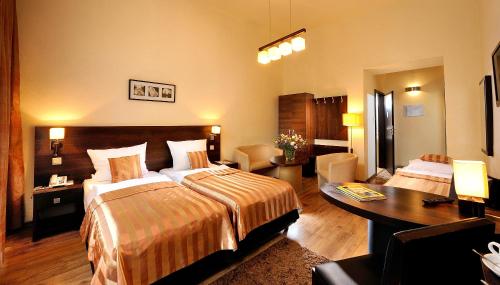 Postel nebo postele na pokoji v ubytování Spatz Aparthotel
