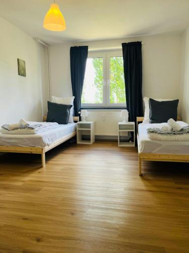 a room with two beds and a window at Convenient Apartment for 4 in Bobitz