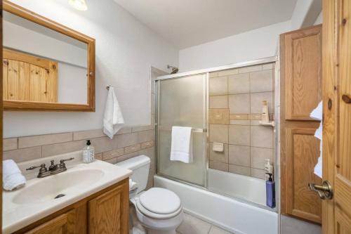 a bathroom with a sink and a toilet and a shower at Summit Condo at St. Marys in Ninetyfour