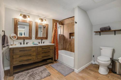 a bathroom with a sink and a tub and a toilet at Cabin by North Clear Creek. Private Hot Tub. Pets in Central City
