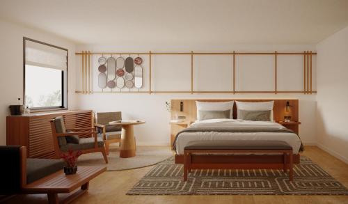 a bedroom with a large bed and a chair at The Amaya - 21 and older only in Fort Wayne