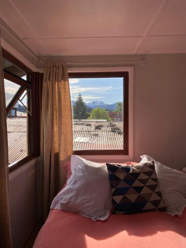 Llit o llits en una habitació de Patagon Backpackers