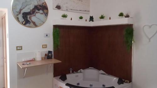 a bathroom with a sink and a mirror on the wall at Suite Romeo in Bari