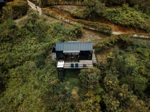 an aerial view of a house in the woods at The Boato Hotel in Guatapé