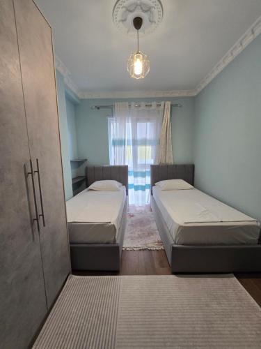 Ένα ή περισσότερα κρεβάτια σε δωμάτιο στο Univers City House