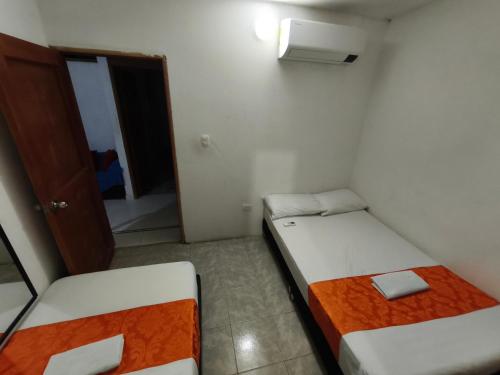 Postel nebo postele na pokoji v ubytování Cabaña Gaia Rodadero