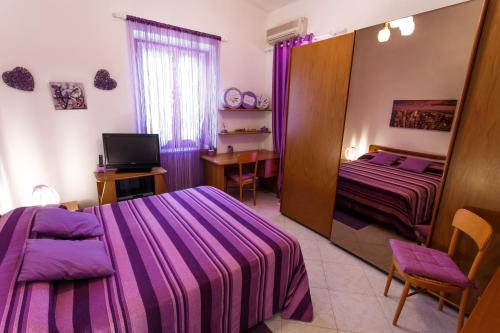 Postel nebo postele na pokoji v ubytování L'Aurora Viola