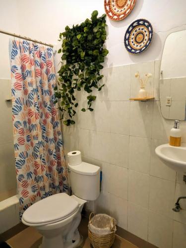 a bathroom with a toilet and a sink at MejorClub in Valle de Anton
