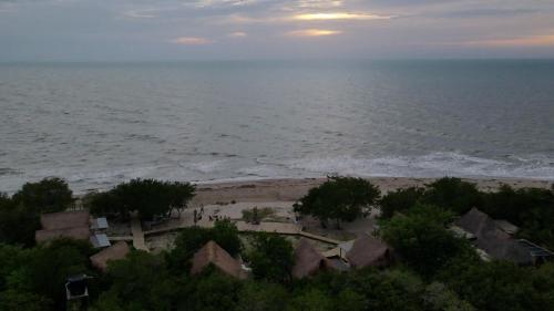 an aerial view of a beach with the ocean at Awatawaa Ecolodge in La Punta de los Remedios