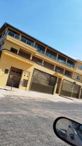a view of a building from the side of a car at Hotel Real Ipiranga in Três Marias