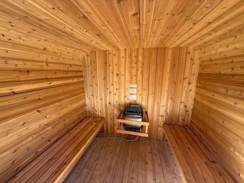 an inside of a wooden sauna with a stove at Natl Park 2BR Townhome King 2-Car Garage in Salt Lake City