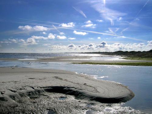 a sandy beach with a body of water at 6 person holiday home in Hadsund-By Traum in Øster Hurup