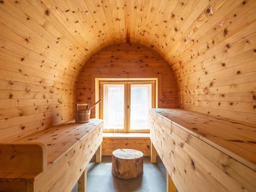 an interior of a wooden cabin with a window at Schloss Sissi - S in Stuben