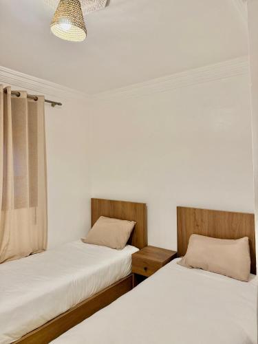 SurfsHub Hostel Tamraghtにあるベッド