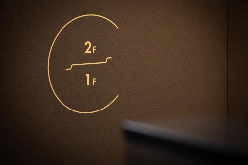 a close up of a chemical symbol on a wall at Hotel Yatsu in Komatsu