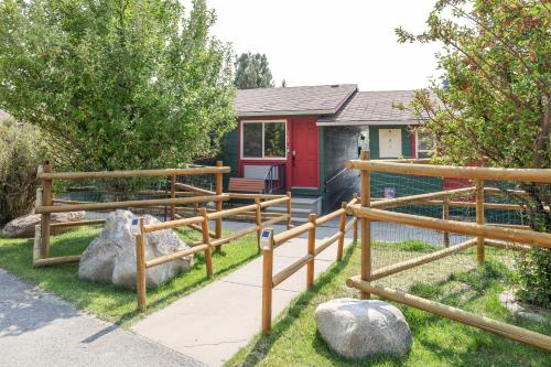 a fence in front of a house at Yellowstone Gateway Inn in Gardiner