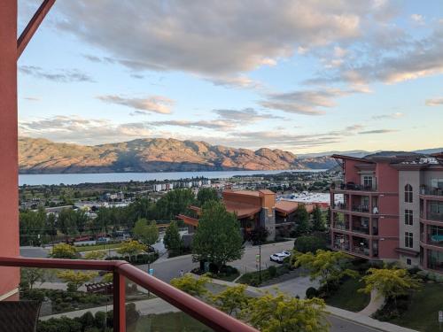 a view from the balcony of a building with mountains in the background at Copper Sky Paradise in West Kelowna