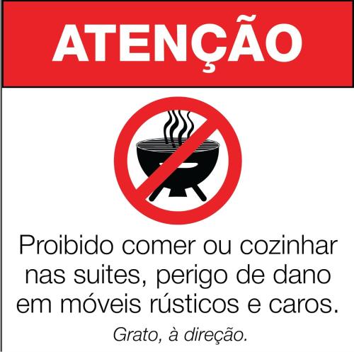 a sign that reads atengriouador has a bowl of food at Recanto Due Fratelli in Campos do Jordão