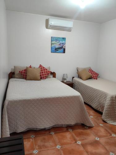 Ένα ή περισσότερα κρεβάτια σε δωμάτιο στο Hotel Hacienda Casa del Viento
