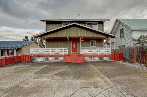 a house with a red door in a driveway at Northern Lights home in White Salmon