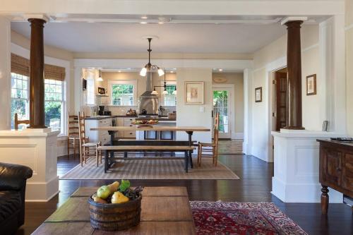 a kitchen and living room with a table and chairs at Cascade Chic home in Hood River
