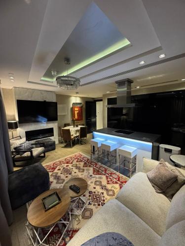 a living room with a couch and a table at 3 Bed 2 Bath Luxury Apartment in Kensington in London
