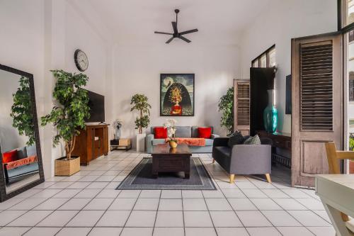 a living room with a couch and a table at Spanish Old San Juan Penthouse in San Juan