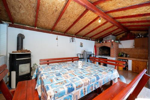 a bedroom with a bed with two benches and a fireplace at Apartments with parking space Palit, Rab - 22676 in Rab