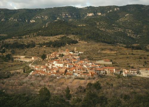 a group of houses on a hill with mountains at Loft Cuco in Puebla de Benifasar